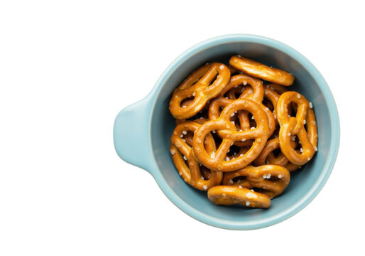 Salty pretzels in a blue bowl isolated, crunchy snack food for parties and gatherings, on a clean background