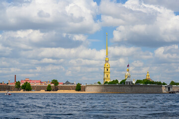 View of the tower and spire of the Peter and Paul Fortress in St. Petersburg from the Neva River