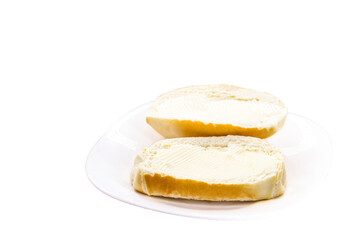 Brazilian French bread, served with butter, on isolated white background, copyspace Brazilian breakfast