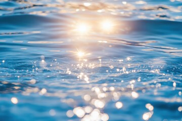 Bright sunlight reflecting on the surface of tranquil blue water