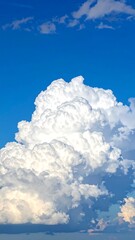 Cumulus clouds against a vibrant blue sky (1)