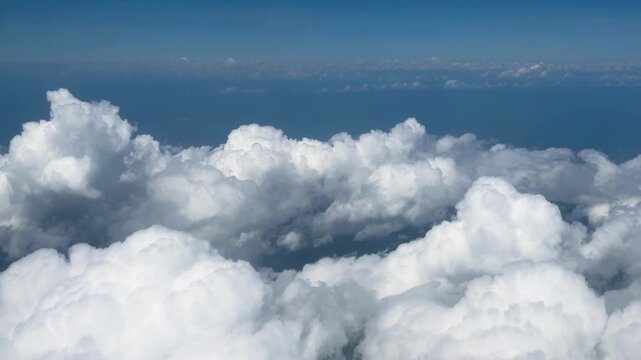 Plain flying in Clouds above Indonesia in Comodo national park. Beautiful aerial clouds view from the plane window