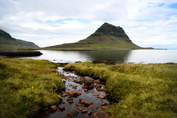 Landscape with reflection by the Kirkjufell mountain in iceland