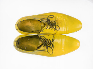 Yellow men's shoes isolated on white background