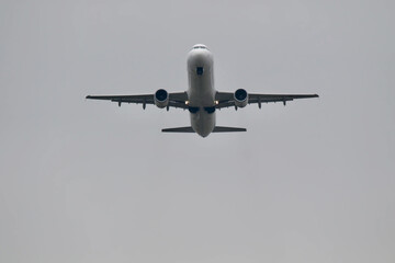 airplane coming up in the sky