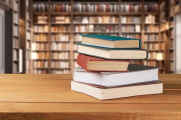 pile of old reading books on shelves in library