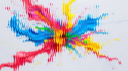 Vibrant splash of colorful paints explodes across white surface creating an eye-catching abstract art piece with dynamic energy and modern appeal