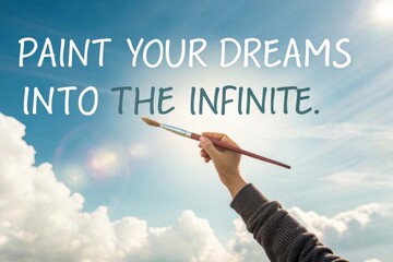 Paint Your Dreams Into The Infinite text with paintbrush and hand in sky