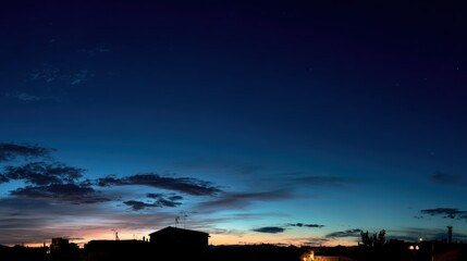 Twilight Sky Over Urban Landscape with Silhouetted Buildings