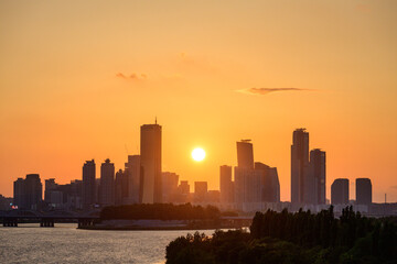 The night view of the city of Yeouido, a high-rise building, shot at Dongjak Bridge in Seoul at sunset