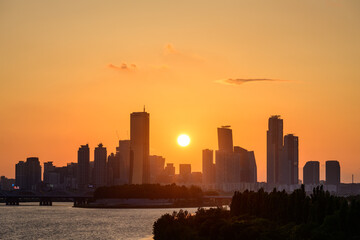 The night view of the city of Yeouido, a high-rise building, shot at Dongjak Bridge in Seoul at sunset