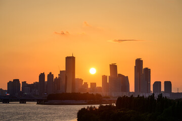 The night view of the city of Yeouido, a high-rise building, shot at Dongjak Bridge in Seoul at sunset