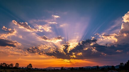 Breathtaking Sunset with Colorful Clouds and Radiant Sunbeams