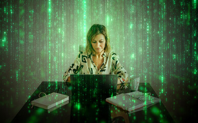 Focused woman working on laptop surrounded by digital matrix code
