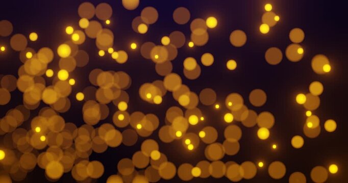 Abstract background with glowing golden bokeh lights on a dark backdrop. Concept of celebration, holiday, glamour, and festive atmosphere.
