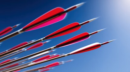 A dynamic shot of colorful arrows in flight against a clear blue sky, symbolizing precision and focus