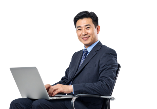 PNG Asian Businessman in Professional Attire Sitting and Typing on Laptop with Smile, Isolated