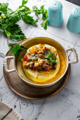 Zucchini stuffed with meat and vegetables, stewed in tomato sauce vertical photo
