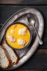 Soup with meatballs, potatoes and cheese on black wooden background. Meatballs in thick vegetable soup Albondigas. Mexican and Spanish, European and Russian cuisine