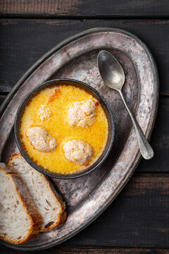 Soup with meatballs, potatoes and cheese on black wooden background. Meatballs in thick vegetable soup Albondigas. Mexican and Spanish, European and Russian cuisine