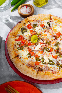 Mexican pizza with meat and jalapeno vertical photo