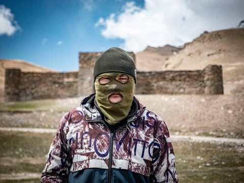 Portrait of a Kyrgyz Nomad Wearing a Balaclava in the Steppe