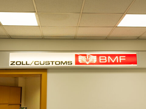 Zoll Customs sign displayed prominently in an airport, featuring the BMF logo, indicating customs area for travelers and enhancing airport navigation experience