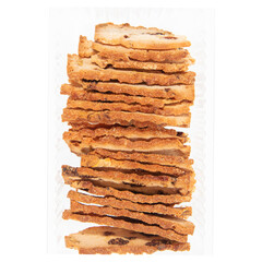 Stack of raisin bread crisps in clear plastic container isolated
