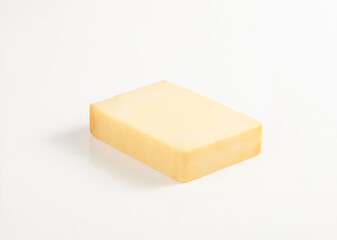 Block of gouda cheese isolated on white background in studio lighting