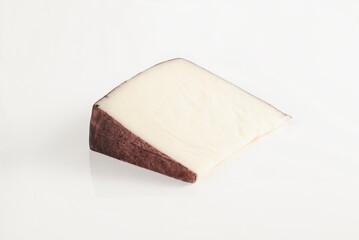 Isolated wedge of bosworth cheese on clean white background studio shot