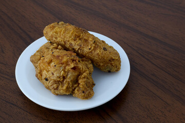 Fried chicken wings on a white plate