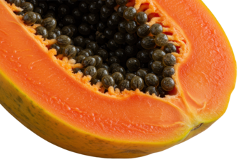Macro of half-cut ripe tropical papaya, vibrant orange flesh, glistening jet-black seeds on transparent, dramatic raking light, natural beauty concept