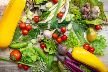 Autumn fresh vegetables on wooden table background