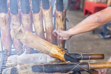Typical food of Ecuador: guinea pig roasting on the grill, prepared with traditional Andean techniques that preserve cultural essence and offer a unique gastronomic experience.	
