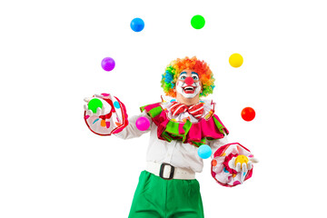 Funny juggler clown juggling balls in the circus, man entertainer as Joker in a suit and wig, with clown whiteface makeup. Trickster, jester, pantomime, mime, and a professional actor at events