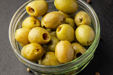 Green olives pickled seedless natural product tasty snack fresh delicious gourmet food background on the table rustic top view copy space