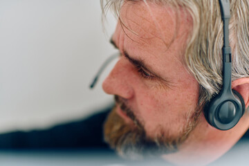 Close Up Portrait of a Customer Support Representative in a Call Center Environment.