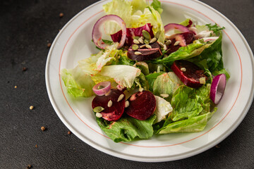 Beet salad green leaf lettuce vegetables natural product tasty snack fresh delicious gourmet food background on the table rustic top view copy space keto and paleo diet vegan and vegan food