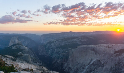 Panoramic view of yosemite valley at sunset with clouds and mountains in the distance landscape scenery