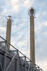 Fototapeta premium Bartle Hall Pylons. Building design. Modern architecture. Modern building architecture against blue sky. Architectural pylon detail. Exterior of building with pylon