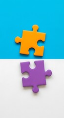 Two Puzzle Pieces, Orange and Purple.