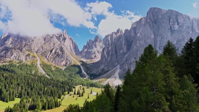 Aerial view of Langkofel mountain in Dolomites, Italy. The top of a mountain Plattkofel Sassopiatto. Dolomites mountain ridge. Seiser Alm Alpe di Siusi aerial view at Summer. Travel in Italy.