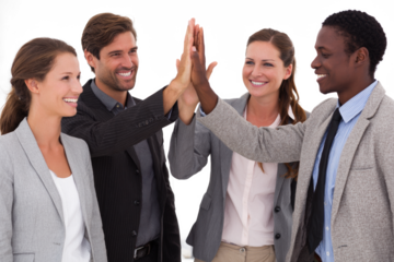 Diverse business team celebrating success with a high five.