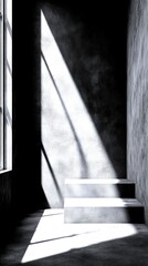 interior with sharp shadows cast by sunlight highlighting steps in a minimalist space