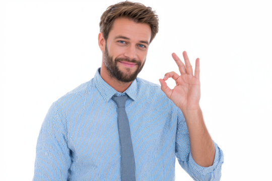 A smiling bearded businessman in a blue shirt and tie makes an okay hand gesture against a white background.