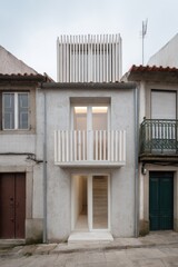 Modern architectural design contrasts with traditional buildings in a quiet urban street showcasing innovative use of space and materials