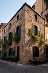 Fototapeta premium Charming brick building with green vines in a quiet city street during golden hour captures the essence of urban tranquility