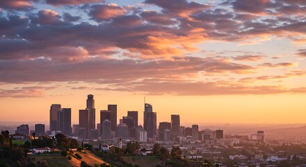 Fototapeta premium City skyline silhouette at sunset with vibrant clouds and warm colors