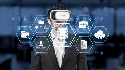A businessman engages with virtual reality technology, visualizing data and information in a modern workspace, showcasing the future of digital business solutions. Raster