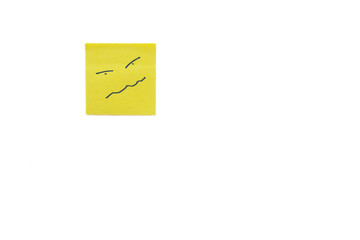 Annoyed face doodle on yellow sticky note